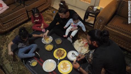 Khadija and her family gather for the nightly Iftar, composed nearly entirely of her neighbor&#39;s leftovers.