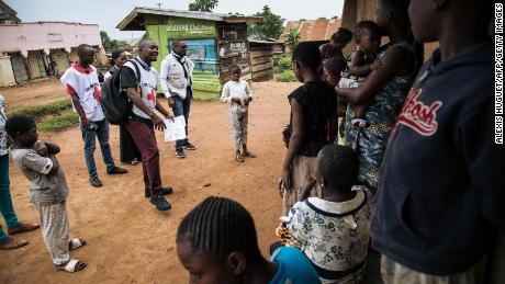 Red Cross officials in northeastern Democratic Republic of Congo meet with families in August 2019 to discuss fears surrounding Ebola and response teams. 