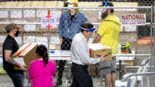 PHOENIX, AZ - MAY 01: Former Secretary of State Ken Bennett (right) works to move ballots from the 2020 general election at Veterans Memorial Coliseum on May 1, 2021 in Phoenix, Arizona. The Maricopa County ballot recount comes after two election audits found no evidence of widespread fraud in Arizona.  (Photo by Courtney Pedroza/Getty Images)