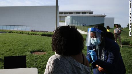 Nurse Kendria Brown from DC Health gives a dose of the Johnson &amp; Johnson vaccine during a walk-up clinic.