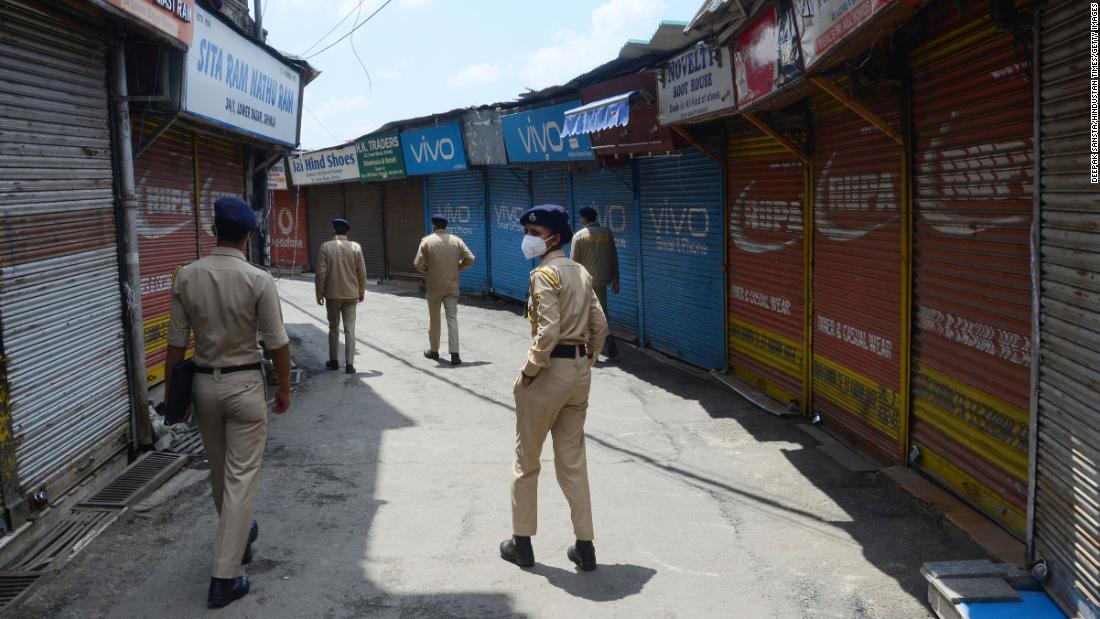 Police in Shimla patrol the streets of the Lower Bazaar area during a curfew on May 8.