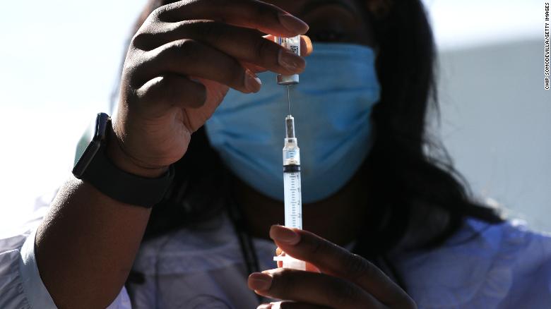 A DC Health nurse manager fills a syringe with a dose of the J&amp;J Covid-19 vaccine in Washington, DC, on May 6, 2021.