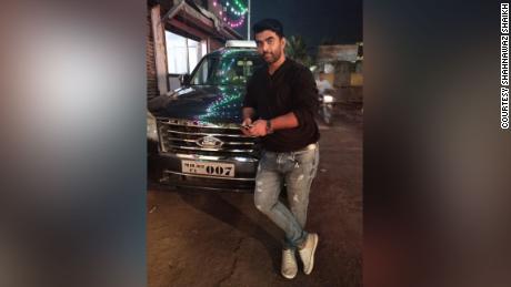 Shahnawaz Shaikh in his SUV, circa 2019, which he later sold to raise funds for his humanitarian work, providing free oxygen to those who couldn&#39;t find or afford it.