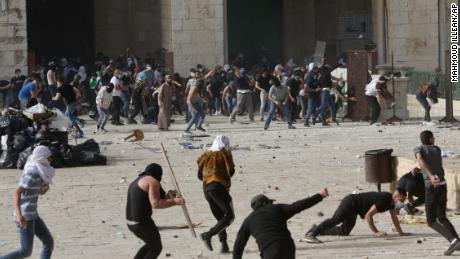 Palestinians clash with Israeli security forces at the Al Aqsa Mosque compound in Jerusalem on Monday. 