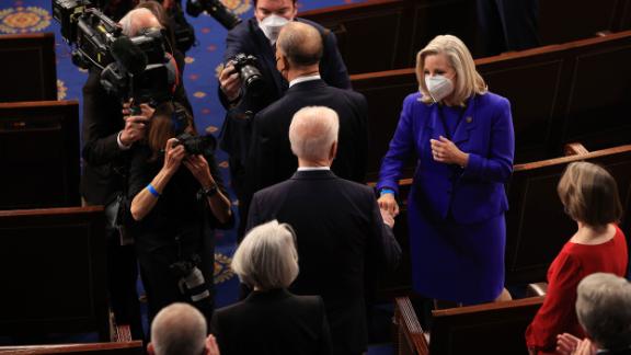 President Joe Biden fist-bumps Cheney as he arrives to speak to a joint session of Congress in April 2021.