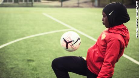 A player keeps a ball up while wearing a Nike Pro hijab.