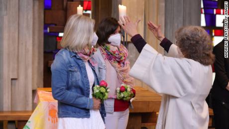 Brigitte Schmidt (R), a pastoral worker, blesses a same-sex couple, Nini and Juliana Weinmeister-Bisping, at the Catholic St. Johannes XXIII church on May 10 in Cologne, Germany.
