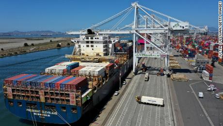OAKLAND, CALIFORNIA - MAY 07: In an aerial view, an container ship is unloaded at the Port of Oakland on May 07, 2021 in Oakland, California. The Port of Oakland reported a record high in cargo traffic volume between January and March of this year with 631,119 20-foot shipping containers compared to 612,151 set in the first quarter of 2019. (Photo by Justin Sullivan/Getty Images)