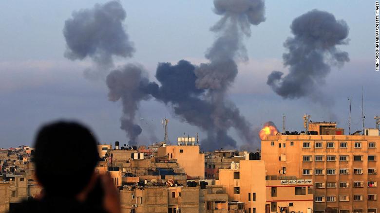 Smoke billows from buildings during Israeli airstrikes on the southern Gaza region of Khan Yunis on Tuesday.