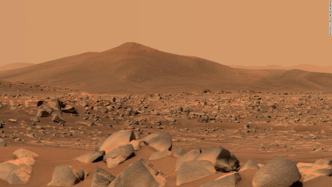 NASA&#39;s Perseverance Mars rover used its dual-camera Mastcam-Z imager to capture this image of &quot;Santa Cruz,&quot; a hill about 1.5 miles (2.5 kilometers) away from the rover, on April 29, 2021, the 68th Martian day, or sol, of the mission. The entire scene is inside of Mars&#39; Jezero Crater; the crater&#39;s rim can be seen on the horizon line beyond the hill.This scene is not white balanced; instead, it is displayed in a preliminary calibrated version of a natural-color composite, approximately simulating the colors of the scene as it would appear to a person on Mars. An enhanced color version is also included.