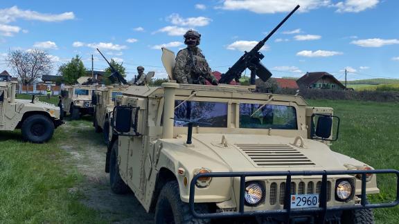 Humvees and troops prepare to join a military training with US, Ukrainian and Romanian special forces in Reghin, Romania.