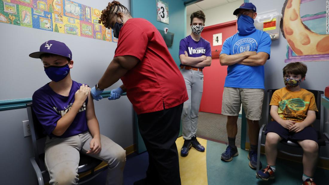 Family members look on as Jack Frilingos, 12, receives a Covid-19 vaccine in Decatur, Georgia, on May 11. It was a day after the US Food and Drug Administration &lt;a href=&quot;https://www.cnn.com/2021/05/11/health/us-coronavirus-tuesday/index.html&quot; target=&quot;_blank&quot;&gt;authorized Pfizer&#39;s vaccine for the 12-15 age group.&lt;/a&gt;