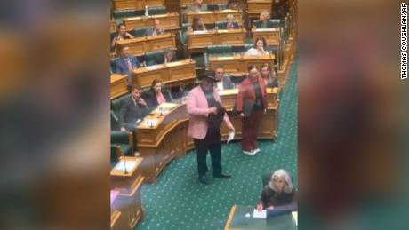 Indigenous New Zealand lawmaker Rawiri Waititi, center, performs a Māori haka in parliament on Wednesday, May 12, 2021.  