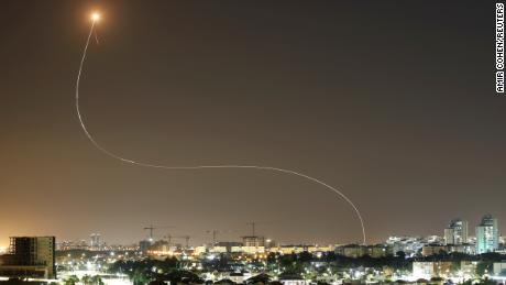 A streak of light is seen from Ashkelon as Iron Dome intercepts rockets launched from Gaza towards Israel on May 11.