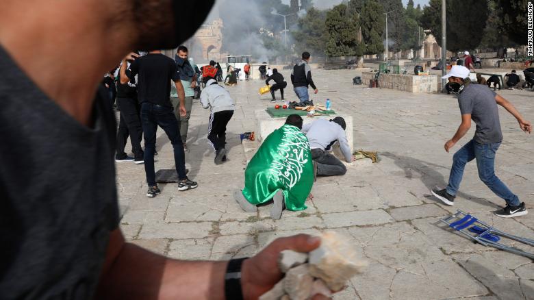 Palestinians clash with Israeli security forces at the Aqsa Mosque compound in Jerusalem&#39;s Old City on May 10.
