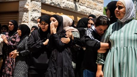 Mourners react during the funeral of Israeli Arab Khalil Awaad and his daughter Nadine, 16, in the village of Dahmash near the Israeli city of Lod, on Wednesday.