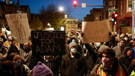 Protesters march through Logan Square neighborhood during a protest on April 16, 2021, over the killing of 13-year-old Adam Toledo.