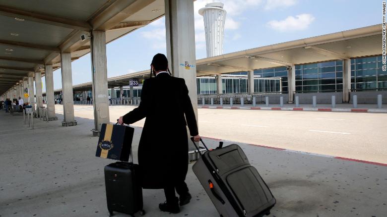 A passenger rolls his luggage at the nearly deserted Ben Gurion airport in Lod, Israel, on May 13. Global airlines were &lt;a href=&quot;https://edition.cnn.com/2021/05/13/business/airlines-canceled-flights-israel/index.html&quot; target=&quot;_blank&quot;&gt;canceling flights to Israel&lt;/a&gt; as clashes intensified between the country&#39;s military and Palestinian militants.