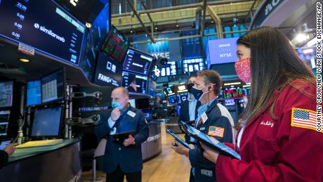 In this photo provided by the New York Stock Exchange, traders work around stock monitoring systems on the trading floor, Wednesday, May 12, 2021, in New York. Inflation worries rattled Wall Street on Wednesday, pulling the Dow Jones Industrial Average more than 680 points lower and placing the major stock indexes on track for their worst week in more than six months. (Courtney Crow/New York Stock Exchange via AP)