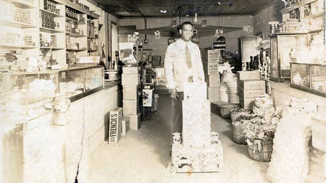 &lt;strong&gt;John D. Mann&lt;/strong&gt; and his brothers, McKinley and &lt;a href=&quot;https://www.neh.gov/article/1921-tulsa-massacre&quot; target=&quot;_blank&quot;&gt;O. B. Mann&lt;/a&gt;, were well-known grocers in the Greenwood District. J.D. is pictured here in the store he owned on North Greenwood Avenue. According to the Tulsa Historical Society, the store was destroyed in the 1921 race massacre.