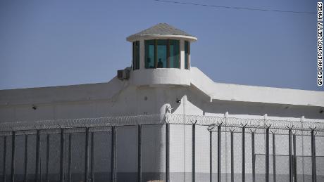 This May 2019 photo shows a watchtower at a high-security facility near what is believed to be a re-education camp where mostly Muslim ethnic minorities are detained, on the outskirts of Hotan, in China's northwestern Xinjiang region.