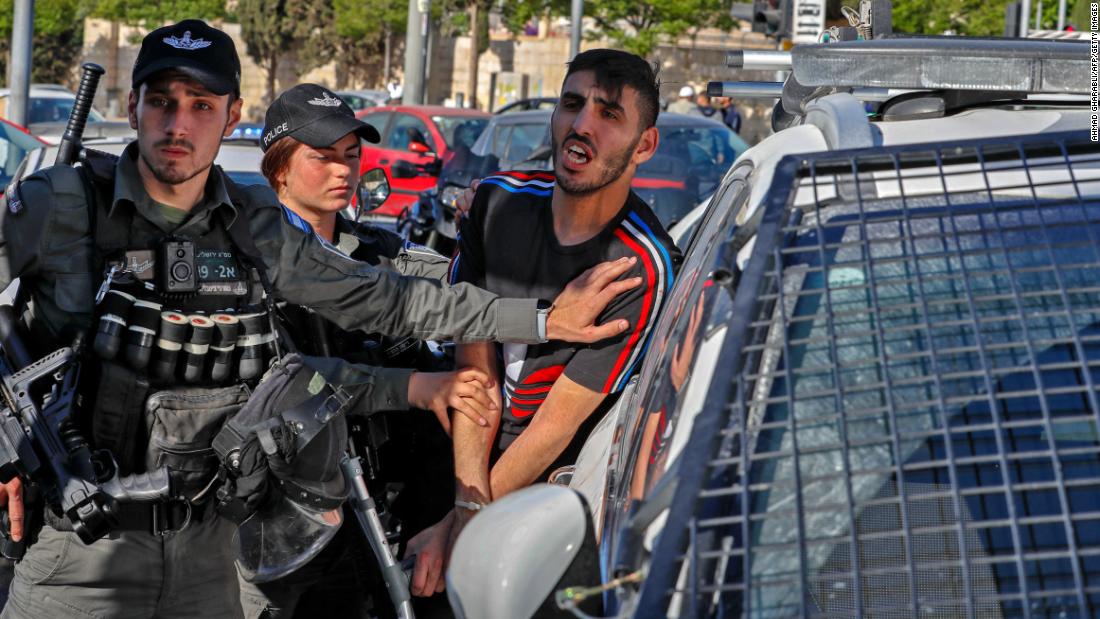 Israeli security forces detain a Palestinian man outside the Damascus Gate in Jerusalem&#39;s Old City on May 13.