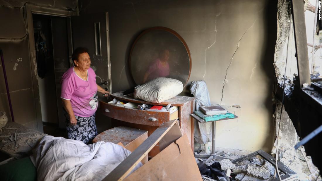 Julianna Sror views the damage to her apartment after it was hit by a rocket fired from Gaza overnight in Petah Tikva, Israel, on May 13.