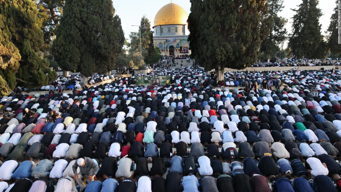 Muslims perform the morning Eid al-Fitr prayer, marking the end of the &lt;a href=&quot;http://www.cnn.com/2021/04/13/world/gallery/ramadan-2021/index.html&quot; target=&quot;_blank&quot;&gt;holy fasting month of Ramadan&lt;/a&gt; in the Aqsa mosque compound in Jerusalem on May 13.