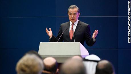 China's Foreign Minister Wang Yi speaks at a promotional event in Beijing on April 12, 2021.