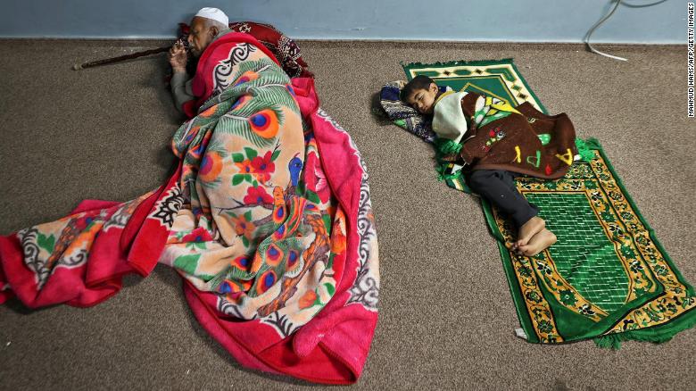 Palestinians take shelter in a UN school in Gaza City on Thursday, May 13.