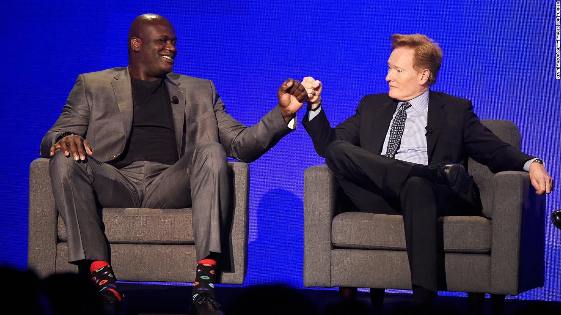 O&#39;Brien fist-bumps basketball legend Shaquille O&#39;Neal during a Turner Upfront show in 2017.