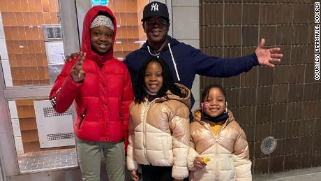 Emmanuel Cooper with his grandkids, Stephanie, Savannah and Kalieah.