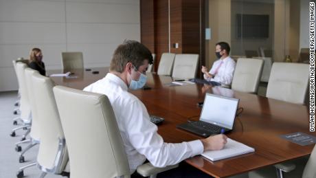 Reopening plans for offices are complicated by new CDC mask guidelines 