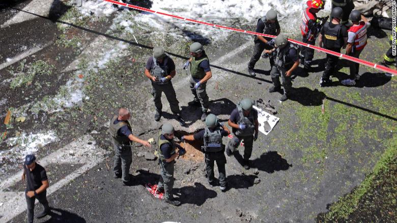 Members of the Israeli emergency services work at a site in Ramat Gan, near Tel Aviv, on May 15, after rockets were launched from Gaza.