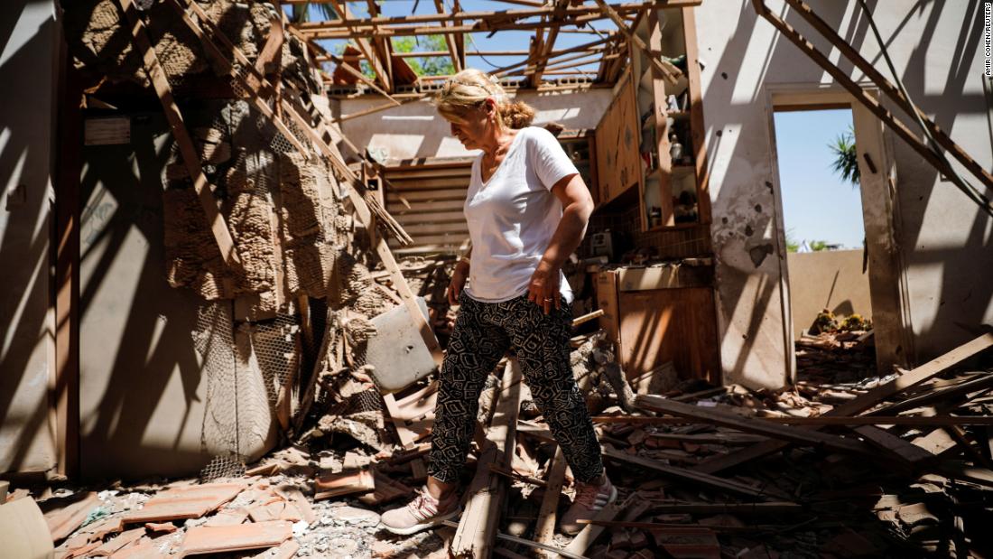 Rachel El-Gazar walks inside her damaged house in Sderot, Israel, following rocket fire from Gaza on May 15.
