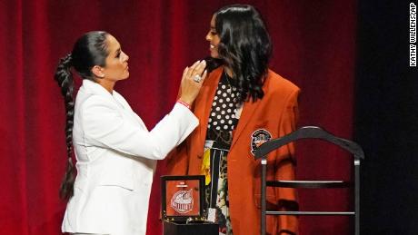 Vanessa Bryant, left, widow of Kobe Bryant, presents their daughter Natalia with Bryant&#39;s Hall of Fame jacket at the 2020 Basketball Hall of Fame awards tip-off celebration and awards gala, Friday, May 14, 2021, in Uncasville, Conn.
