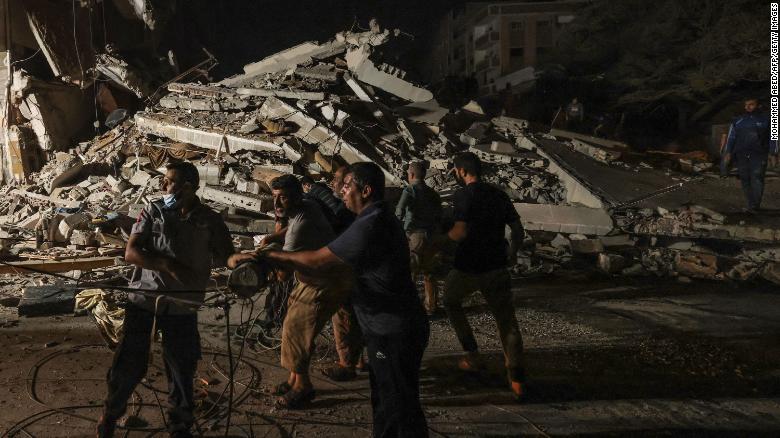 Palestinian firefighters search urgently for survivors and bodies under the rubble after a series of Israeli airstrikes on Gaza on May 16.