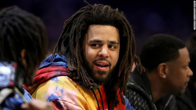 Rapper J. Cole makes his debut in African basketball league the same weekend his album drops