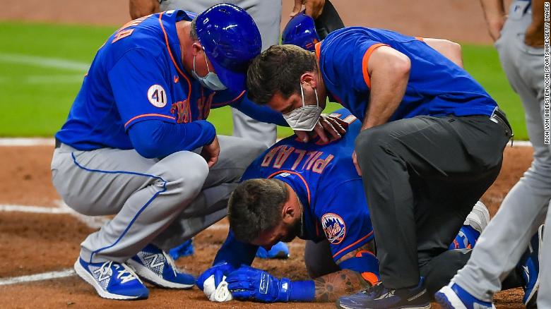 Staff rushes to Kevin Pillar moments after he was hit by a pitch.