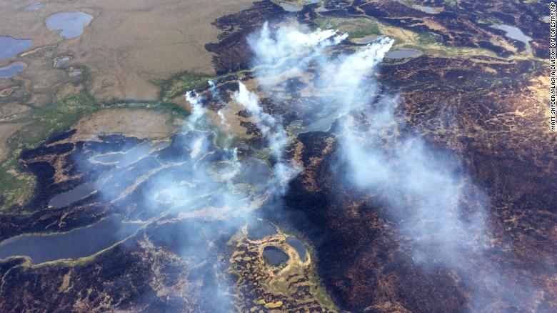 Smoke rises from a fire in Alaska's Yukon Delta National Wildlife Refuge in 2015. A new study finds that wildfires in boreal forests and peatlands of the Arctic can sometimes spawn &quot;zombie fires,&quot; which can burn all the way through winter.
