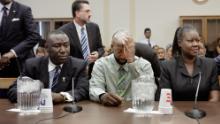 The parents of Trayvon Martin, Tracy Martin, center, and Sybrina Fulton, with Crump at a House Judiciary Committee briefing in Washington on March 27, 2012.