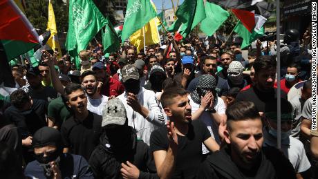 Palestinians protest against Israeli attacks in Hebron, West Bank on May 18.