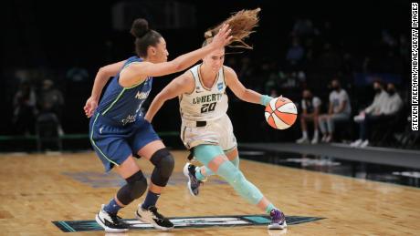 Sabrina Ionescu (R) became the youngest player in WNBA history to record a triple-double.