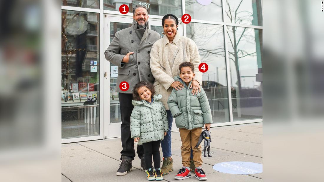 Keewa Nurullah (No. 2) stands with her husband, Doug Freitag (No. 1), and their two kids Noni (No. 3), age 3 and Faraz (No. 4), age 5, outside Kido, their family-owned children&#39;s apparel, book and toy store on Chicago&#39;s South Side, in January 2021.