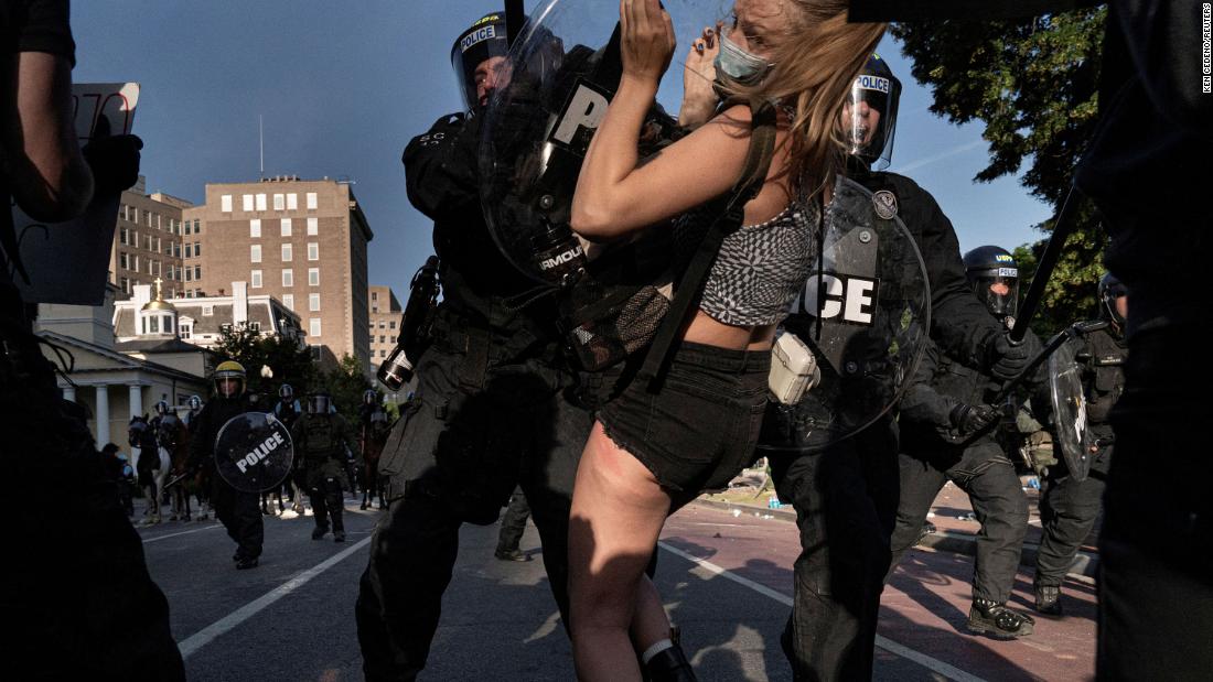 Riot police rush demonstrators in Lafayette Park on June 1.