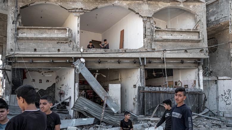 Palestinians inspect damage to buildings in northern Gaza City on May 20. 