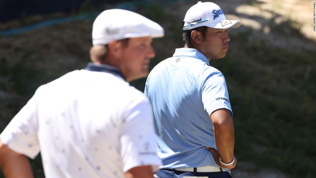 Masters champion Hideki Matsuyama looks on near the 17th green during the first round.