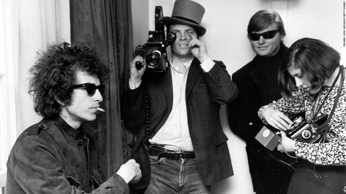 Dylan smokes a cigarette as D.A. Pennebaker films &quot;Don&#39;t Look Back,&quot; a documentary film about Dylan&#39;s tour of England in 1965.