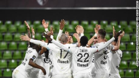TOPSHOT - Lille&#39;s players celebrate after scoring a goal during the French L1 football match between Metz (FC Metz) and Lille (LOSC) at Saint Symphorien stadium in Longeville-les-Metz, eastern France, on April 9, 2021. (Photo by JEAN-CHRISTOPHE VERHAEGEN / AFP) (Photo by JEAN-CHRISTOPHE VERHAEGEN/AFP via Getty Images)