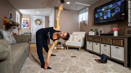 Dennis Guerrero, co-owner and head trainer of fitness platform Life Outside the Box, leads a virtual class from his living room in Long Beach, New York, on November 8, 2020. 